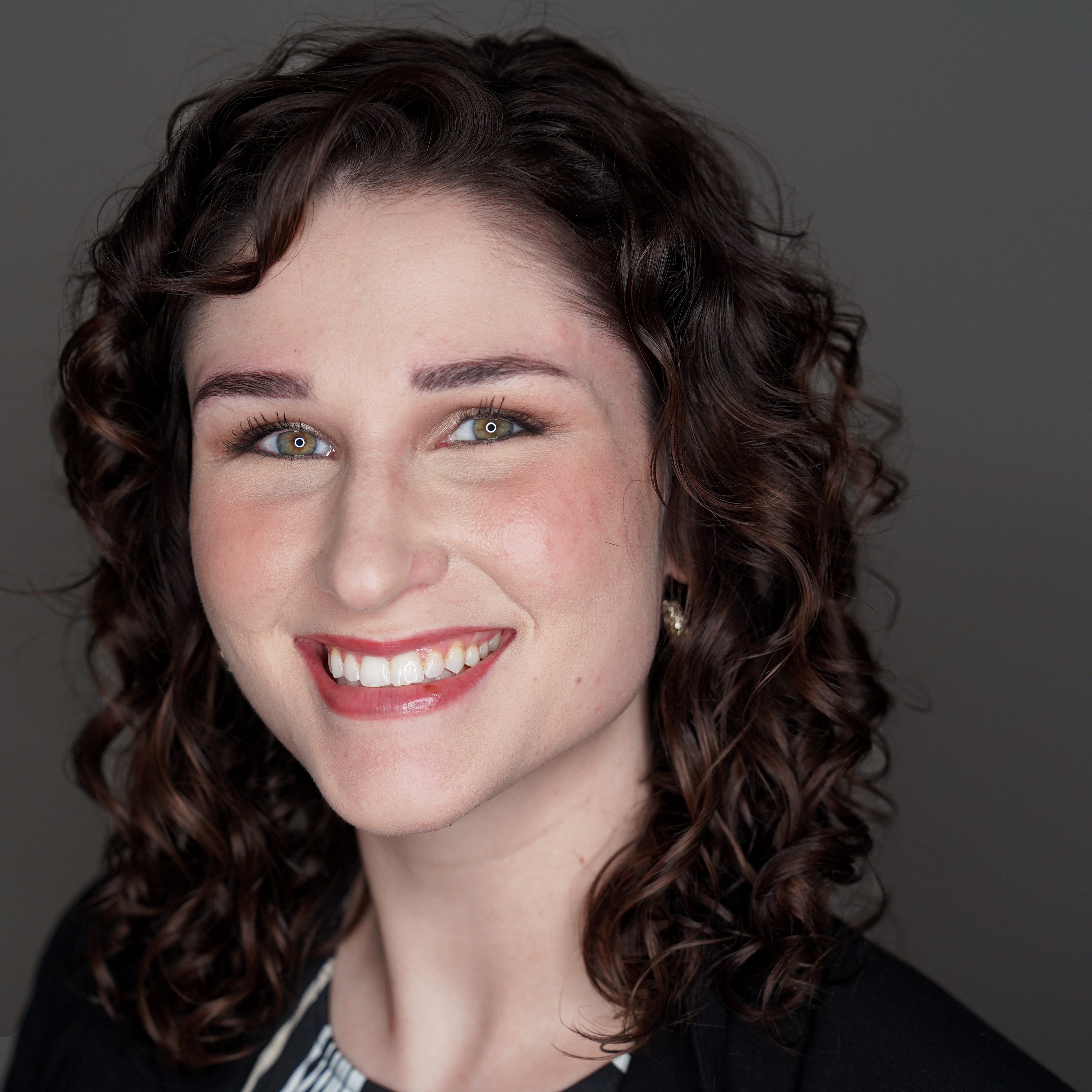 Graduate Fellow Kim Sullivan headshot with dark background
