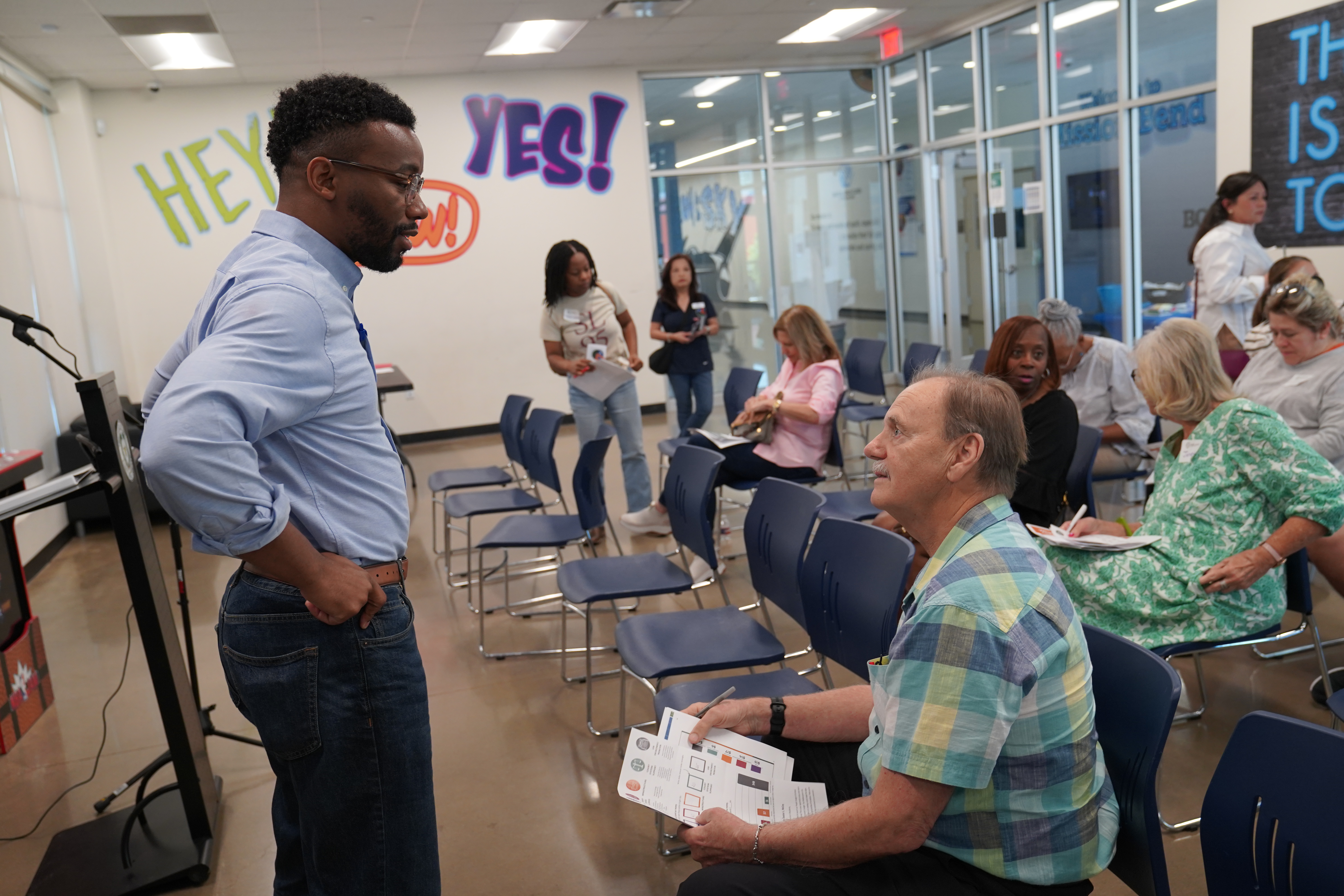 Commissioner Dexter McCoy speaks to residents at Town Hall