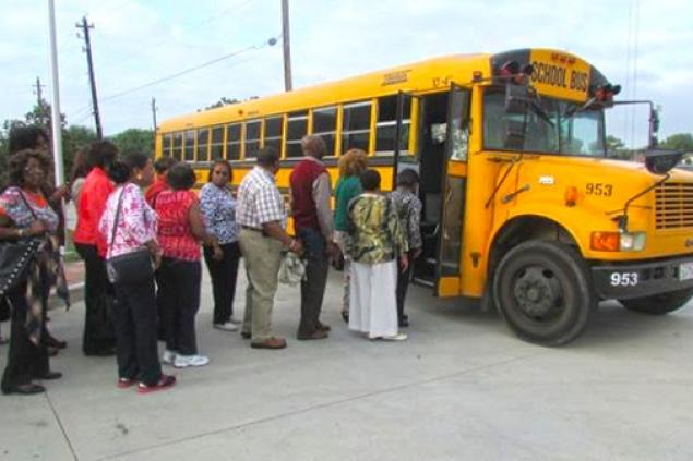 Pinnacle members boarding a bus headed to The Ensemble Theatre