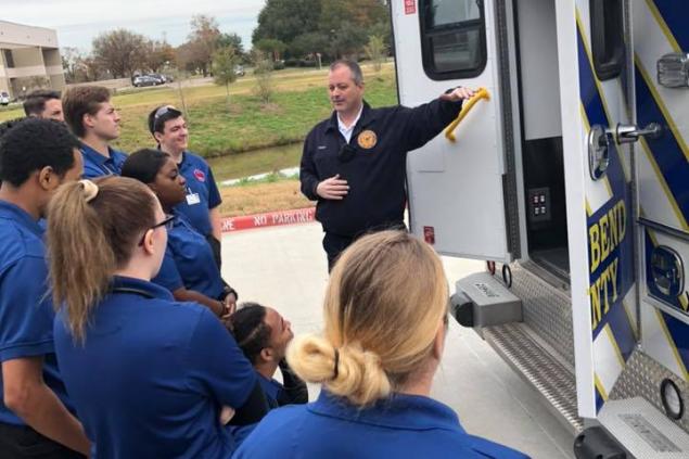 Chief Temple with  EMT students at the Missouri City Campus